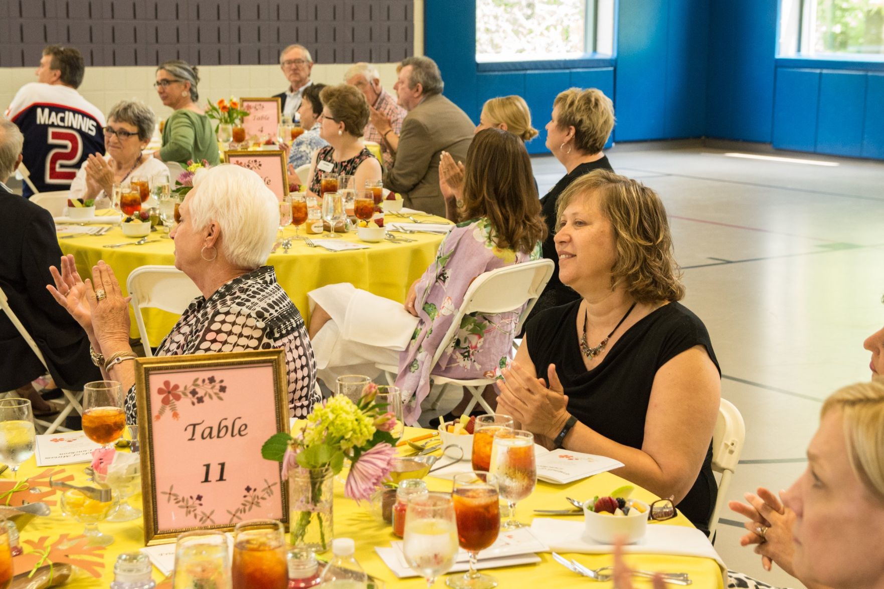 Guests clap for the presenting speaker at the Friends of Miriam Luncheon